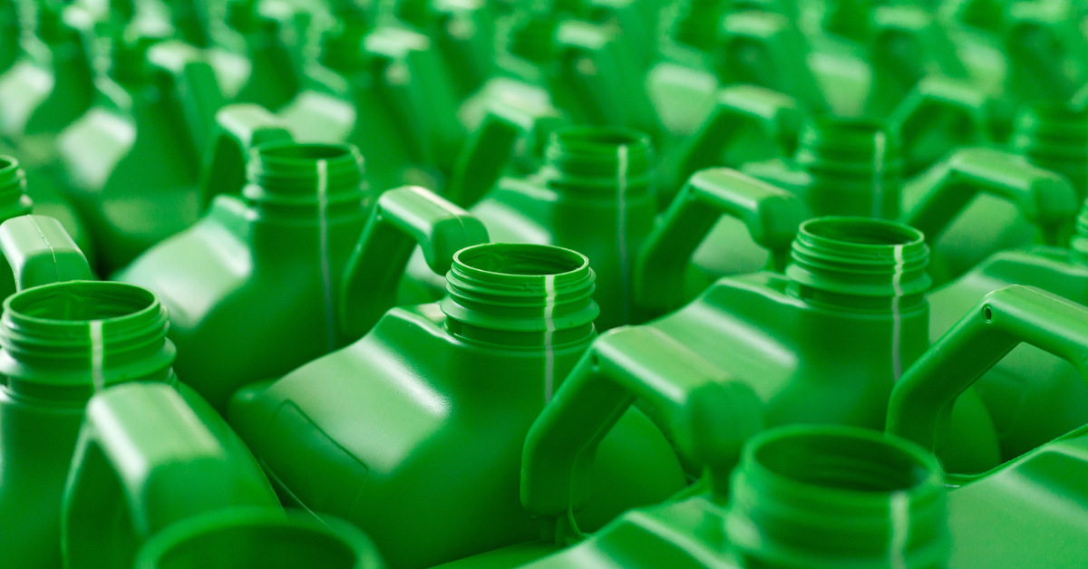 Rows of green bulk liquid storage containers used for 20L and 25L packaging
