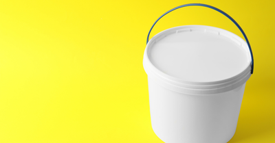 White plastic tub with lid and carry handle on a yellow background